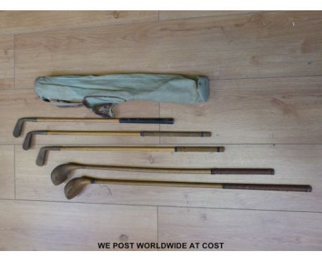 Childrens' vintage golf clubs in cloth bag
