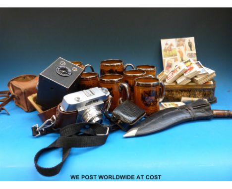 A vintage Agfa camera, box camera, kukri, cigarette cards and a quantity of tankards