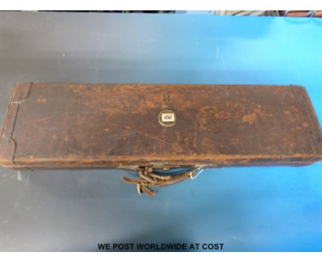 A vintage leather fitted gun case with W Richards label inside lid