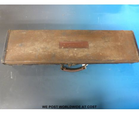 A vintage canvas and leather gun case with E J Churchill label inside lid