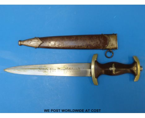 A German Nazi Third Reich SA dagger by Klittermann & Moog GmbH, Solingen with wooden grips and 21.7cm blade engraved 'Alles F