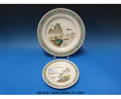 A Chinese dinner service with famille bleu border and landscape centre comprising eight dinner plates, side plates, soup bowl