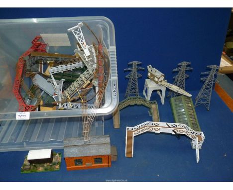 A tub of model railway scenery including fences, platforms, etc.