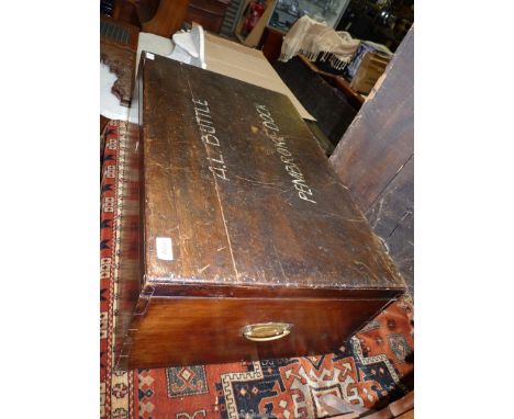 A dark Mahogany travelling Chest/Trunk with brass backplate carrying handles, the top with painted lettering 'A.L Buttle Pemb