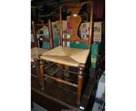 An elegant Oak and other woods Side Chair having an urn shaped splat, turned front legs united by a well worn turned stretche