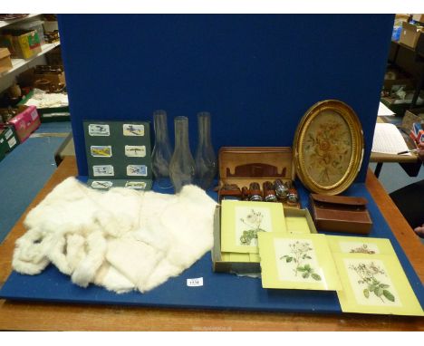 A quantity of miscellanea including oval framed embroidery, three glass oil lamp chimneys, cigarette card album, glass plate 