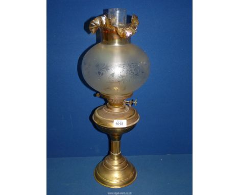 A Brass paraffin Lamp with, frosted lamp shade with fluted top, 22" high.