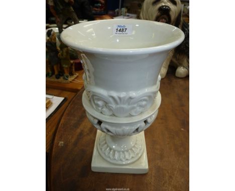 An urn shaped vase with scroll design, 1' high.