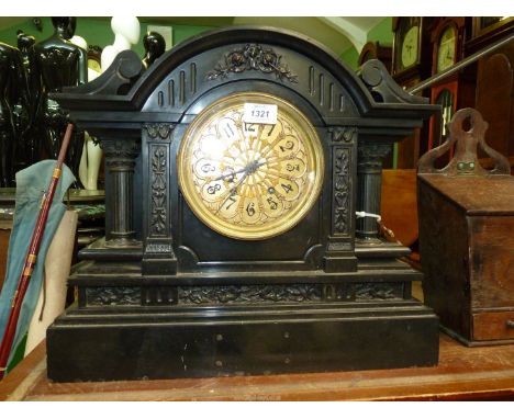 A very heavy and imposing black marble/slate mantel clock the gilded detail face with Arabic numerals, the two-train movement