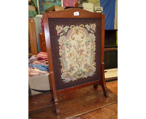 A Woolwork panelled firescreen.