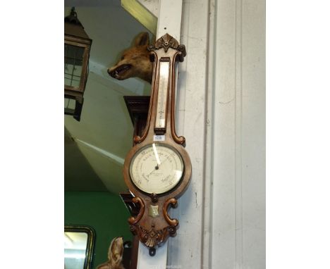 A Walnut 'Callaghan & Co' banjo, Aneroid Barometer, circa 1890, having shield plaque to base 'L.P.T. Xmas 1890', 31 3/4".