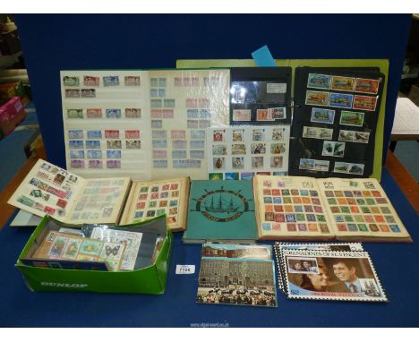 A quantity of stamp albums with contents and loose stamps, stamp sets, First Day covers, etc.