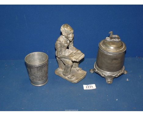 A carved stone figure of a seated elderly man with pan pipes in his hands, lidded Pewter pot with hound finial and a metal be