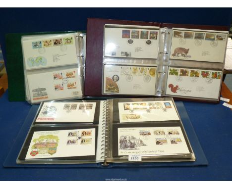 Three albums of Royal Mail first day covers, 1980's-1990's.
