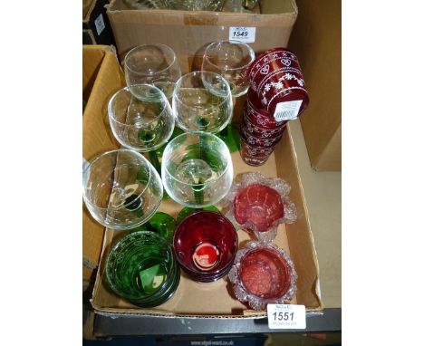 Six hock glasses and a quantity of green and red night light holders, two cranberry dishes and two small cut glass candle hol