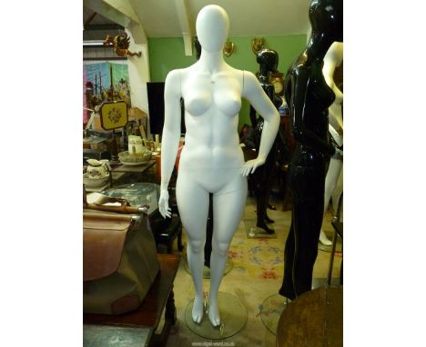 A white shop mannequin in a matt finish, 73" tall. N.B. VAT at 20% will be added to the hammer price of this lot.