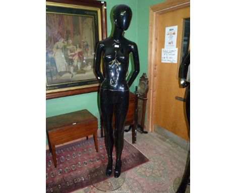 A black gloss full body shop mannequin, 73" tall. N.B. VAT at 20% will be added to the hammer price of this lot.