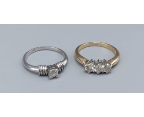 A 9ct gold three stone Diamond ring together with a 9ct gold solitaire Diamond ring, 4.2gms