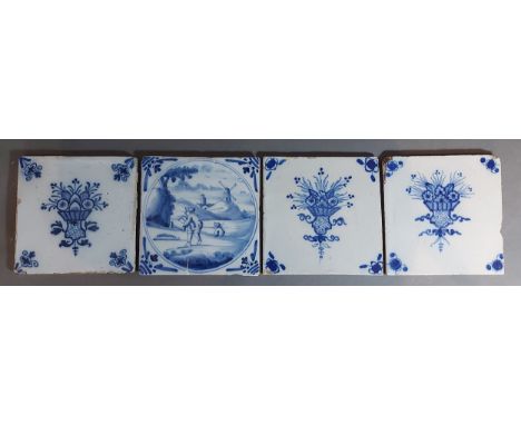 A group of four 18th Century Delftware tiles decorated underglaze blue 