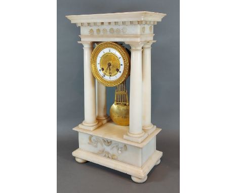 A 19th Century French white marble Portico clock, the brass and ceramic dial with Roman numerals and two train movement, 48cm