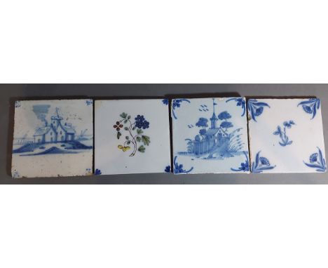 A group of four 18th Century Delftware tiles decorated underglaze blue 