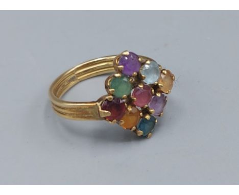 A yellow metal multi stone set ring, ring size L, 3.2gms