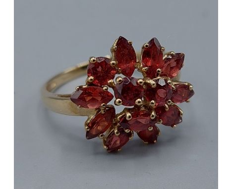 A 9ct gold Garnet set cluster ring, 3.7gms, ring size U