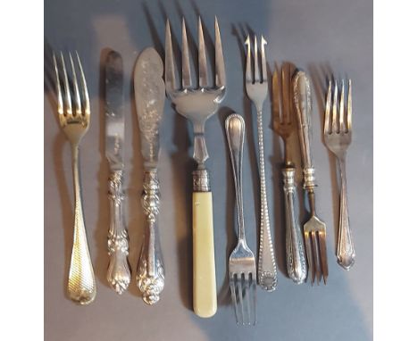 A London silver bone handled serving fork together with a collection of knives and forks 