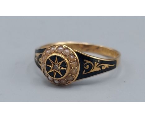 A Victorian 18ct gold mourning ring set with a small Diamond surrounded by Pearls with black enamel, 3.1gms, ring size R