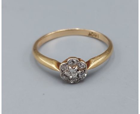 An 18ct gold Diamond cluster ring set with six Diamonds, 2.2gms, ring size P
