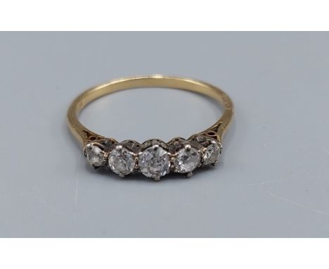 An 18ct gold five stone Diamond ring, claw set, 2gms, ring size P