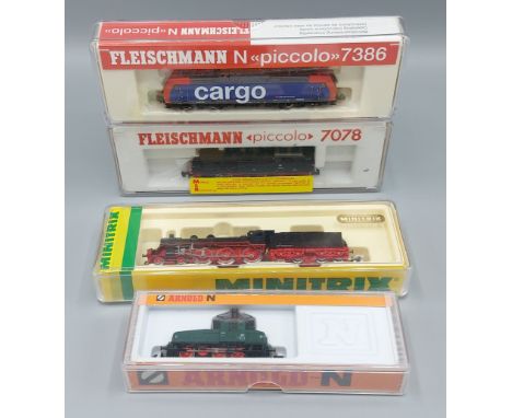 A Fleischmann locomotive, Piccolo number 7078 together with another 7386, a Minitrix locomotive number 12831 and an Arnold 24