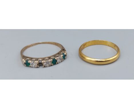 A 22ct gold wedding band, ring size m, 2.2gms, together with a 9ct gold diamond and emerald set ring, one stone missing, 1.5g