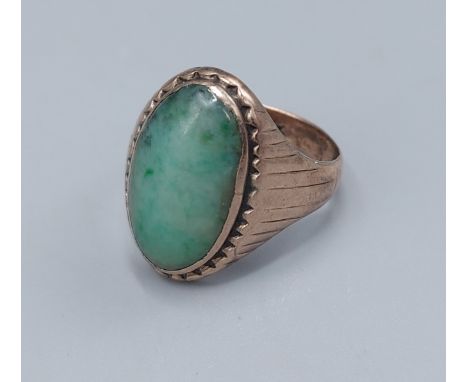 A 14ct gold ring set oval cabochon stone, (cut),7.6gms, ring size S