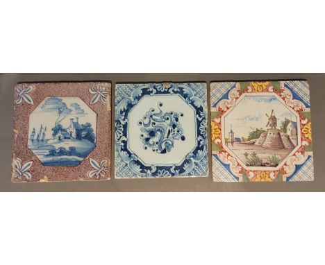 An 18th Century Delftware tile decorated polychrome with a windmill, 13cms square together with two other similar tiles