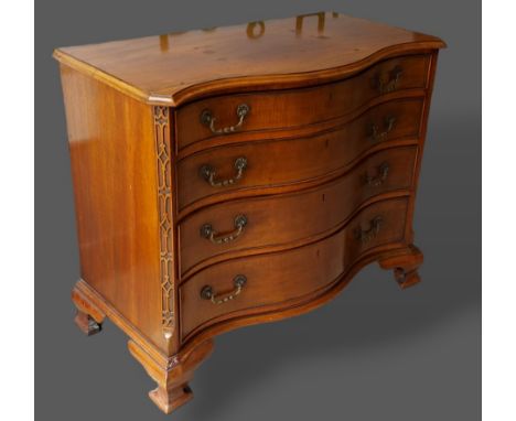 A late 19th Century mahogany Serpentine chest, the moulded top above four drawers with brass handles raised upon Ogee bracket