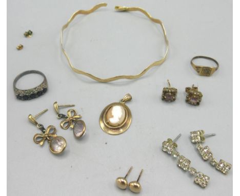 Yellow metal bangle (A/F) with applied 18ct stamp, 5.84g, a pair of 9ct drop earrings set with bows and purple stones, a 9ct 