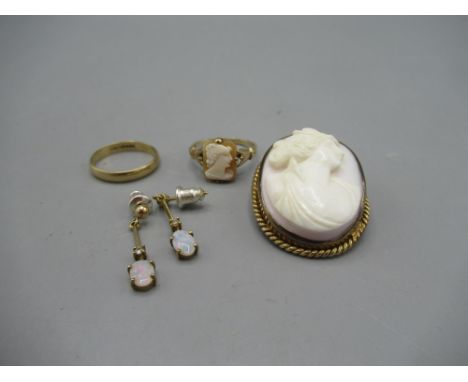 9ct yellow gold band ring, size L, 9ct yellow gold cameo ring, size L1/2, a pair of 9ct opal drop earrings (metal backs), all