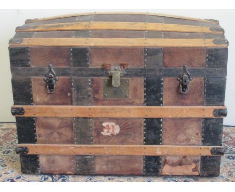 Victorian metal and wood strap bound leather covered dome top travelling trunk, with fitted interior of lift out tray and com