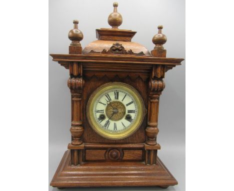 H.A.C. early 20th century oak mantle clock, carved and moulded case, Roman dial, two train striking movement on scroll bearin