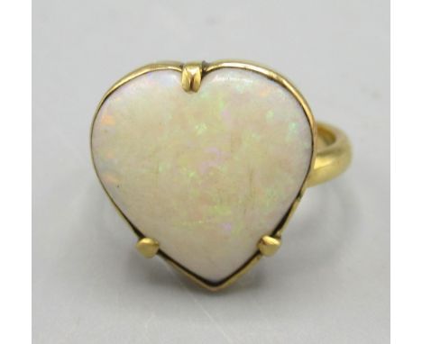 Antique yellow metal ring with claw set heart shaped cabochon cut opal, unmarked, size J, 3.35g
