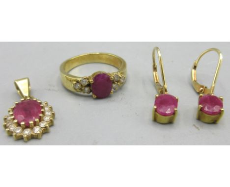18ct yellow gold ring set with oval cut ruby flanked with three diamonds either side, size K, 18ct yellow gold pendant with c