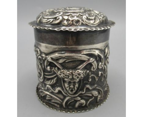 Victorian silver tea caddy decorated in relief with faces, foliate and scrolling repousse by William Comyns &amp; Sons, Londo