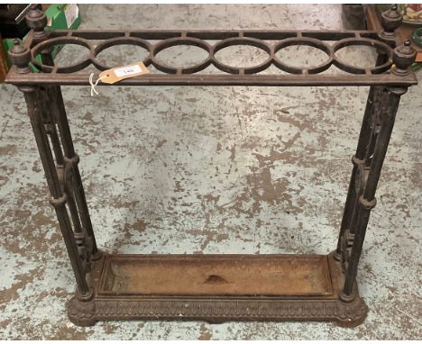 Early 20th century painted cast iron rectangular six division stick stand, floral and rosette cast end supports with urn fini