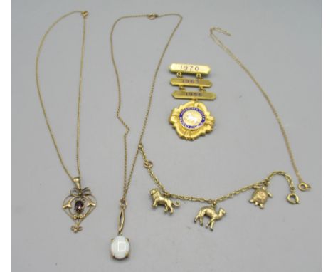 Edwardian yellow metal drop pendant set with seed pearls and red stone, on yellow metal chain, a 9ct gold cross pendant, stam