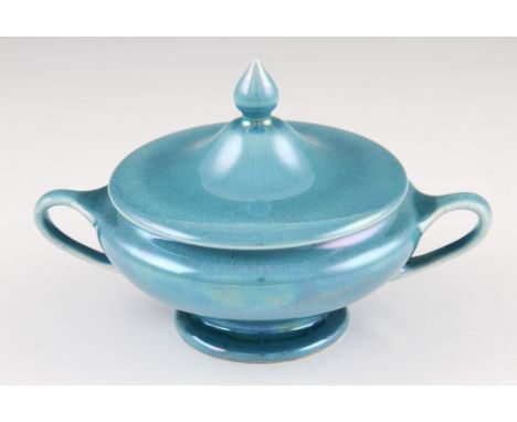 A Ruskin pottery lidded twin handled bowl shape number 512 with light blue lustre glaze finish, stamped to base Ruskin Englan