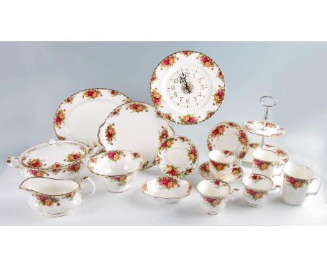 A selection of Royal Albert Old Country Roses tableware to include; cups and saucers, mugs, two tureens, bowl, clock, milk ju