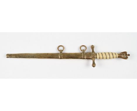 A replica Third Reich Nazi naval dress dagger with brass and faux ivory handle with decorated brass scabbard, blade length 25