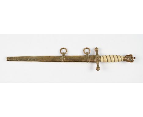 A replica Third Reich Nazi naval dress dagger with brass and faux ivory handle with decorated brass scabbard, blade length 25