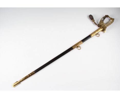 An early 20th Century Naval officer's dress sword, having hinged brass hilt with a lion design pommel with shark skin grip, b